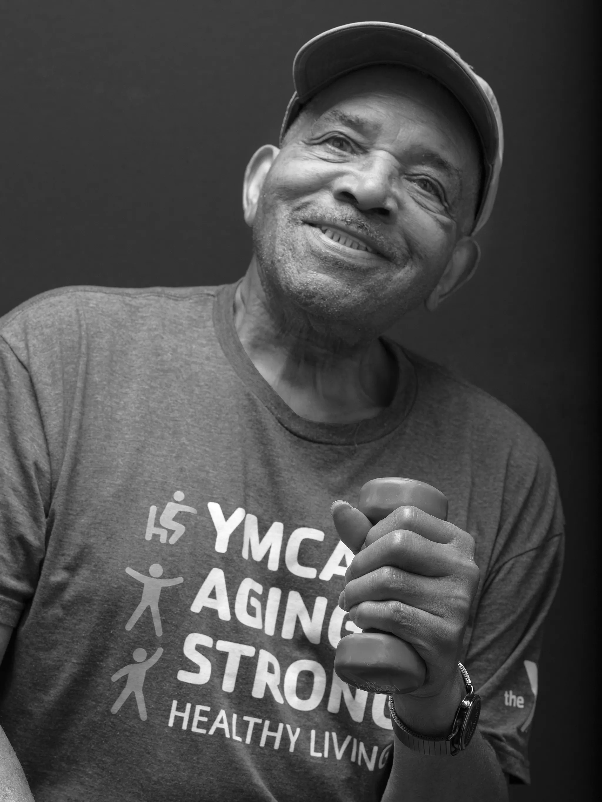black and white portrait of older black man proud of working out